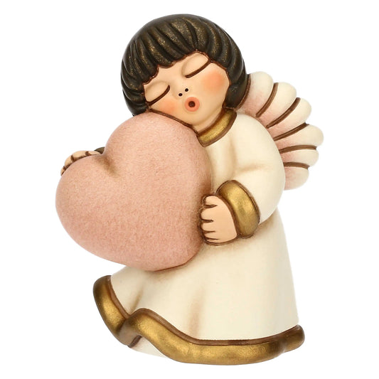 Angelo in ceramica con cuore rosa