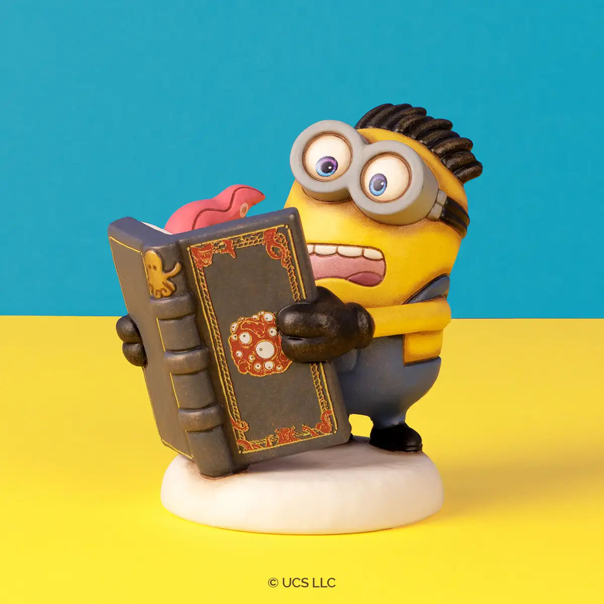 Minions® - Henry con libro