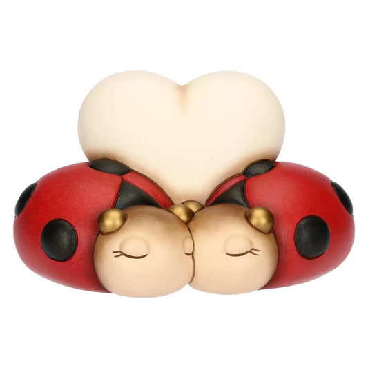 Coppia di coccinelle con cuore in ceramica